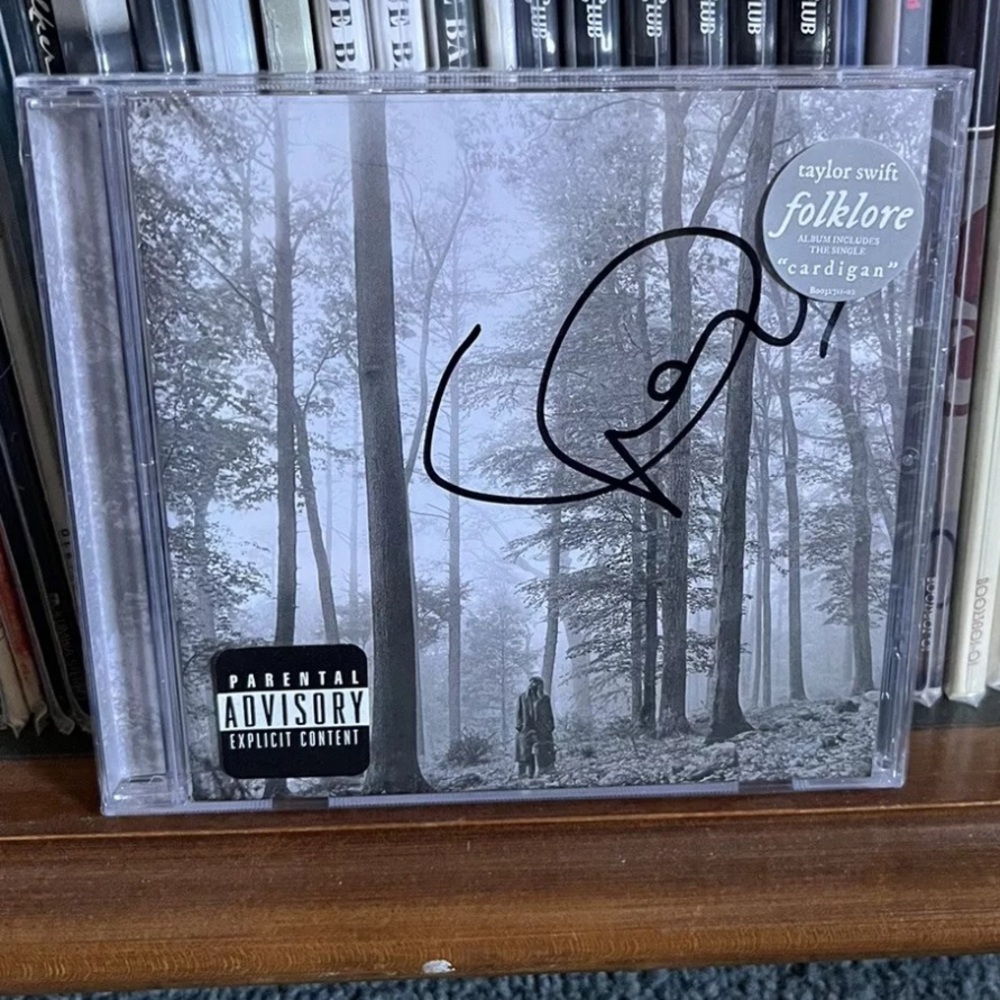 Signed Folklore CD SEALED **possible heart under sticker** long signature
